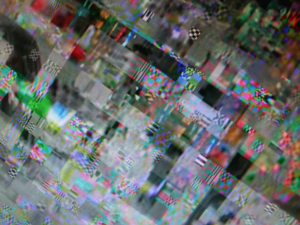Abstract glitch-art digital composition; fragmented, horizontally distorted screen bands.